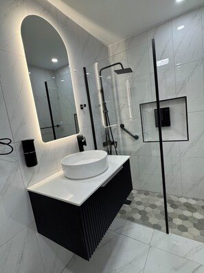 Bathroom - This is an elegantly retrofitted secured ground floor one bedroom apartment. (Kingston)
