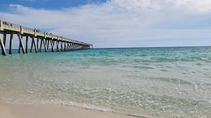A pier extending into calm waters with clear skies. - Dog Friendly | Gulf Front | Heated Pool | Hot tub (Navarre)