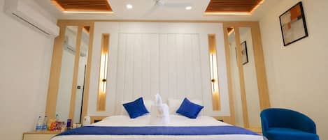 Luxury Suite, Balcony, City View | In-room safe, desk, laptop workspace, blackout drapes