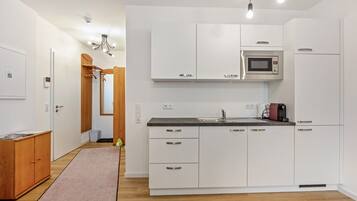 Fridge, microwave, stovetop, coffee/tea maker