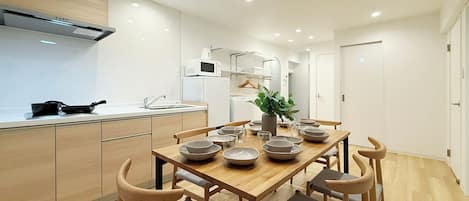 Family Apartment, Balcony | Living area | 55-inch Smart TV with cable channels