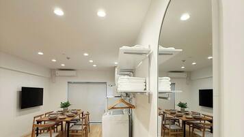 Family Apartment, Balcony | Living area | 55-inch Smart TV with cable channels