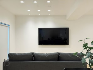 Comfort Apartment, Balcony | Living area | 55-inch Smart TV with cable channels - ITO BLD (Hiroshima City)