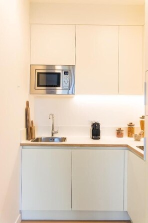Apartamento, sacada | Cozinha privada