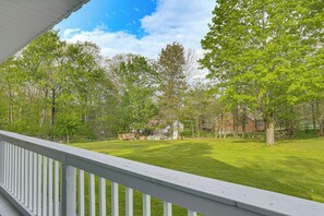 A residential property with a fenced yard, a house, and surrounding trees. - Deck & Patio! Wurtsboro Haven Near Lakes & Trails (Wurtsboro)