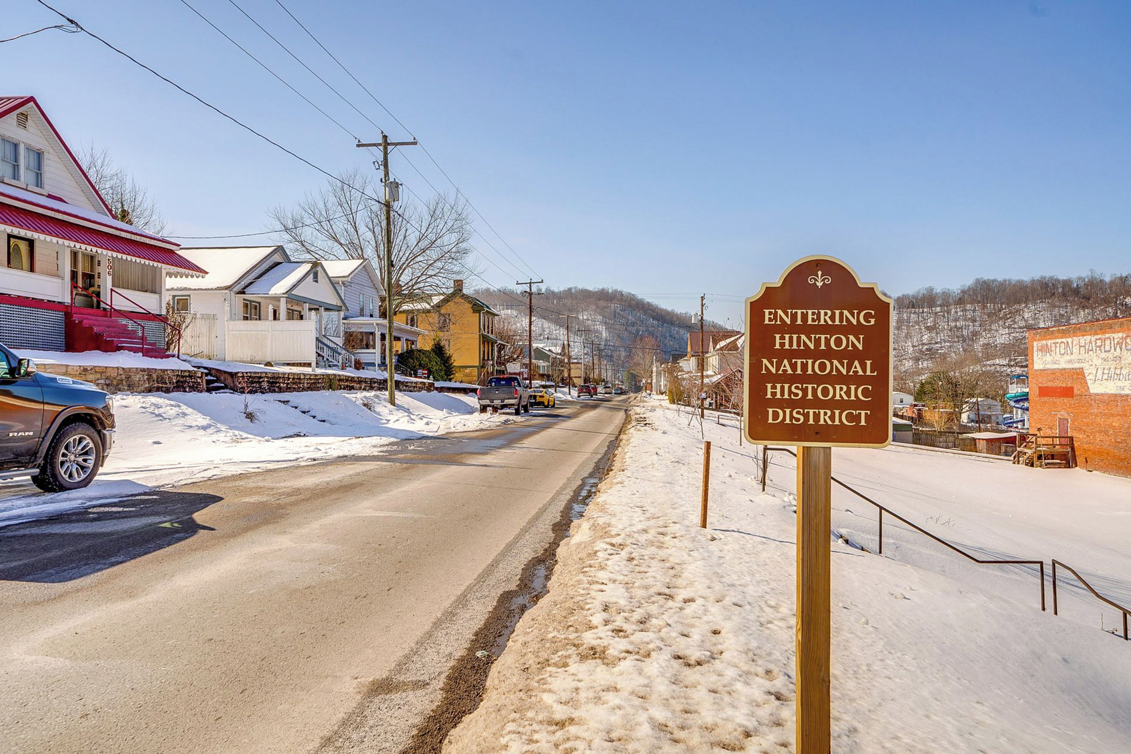 A road with a sign indicating entry into the Hinton National Historic District.