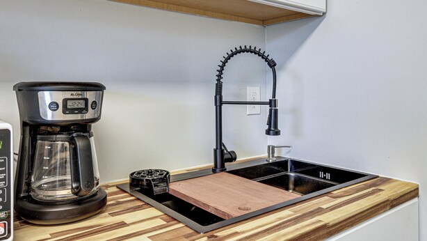 A kitchen with a coffee maker, a sink, and a wooden countertop. - 3 Mi to Dtwn: Pet-friendly Studio in Huntsville (Huntsville)