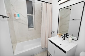 Shower, hair dryer, towels, soap