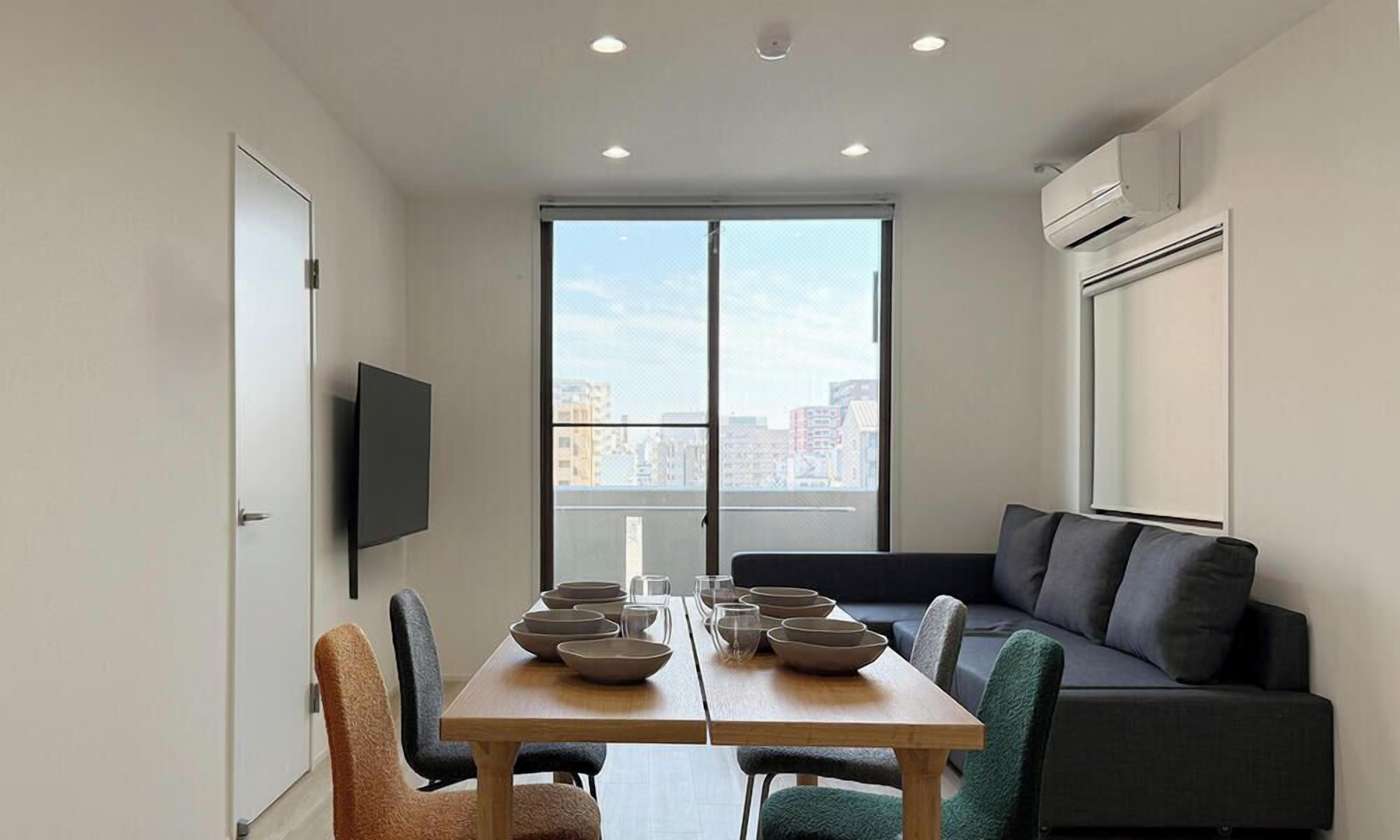 City Apartment | Living area | 65-inch Smart TV with cable channels