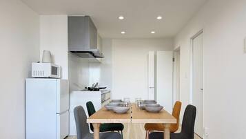 City Apartment | Living area | 65-inch Smart TV with cable channels
