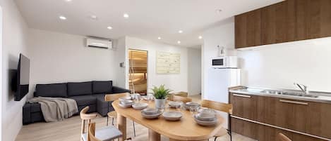Family Apartment, City View | Desk, laptop workspace, iron/ironing board, WiFi (free)