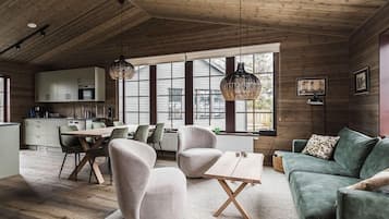 Apartment, 3 Bedrooms, Sauna, Mountain View | Living area | Flat-screen TV