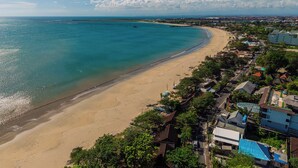 A coastal town with a beach, houses, and a clear sky. - Tropical Villas Jimbaran (Jimbaran)