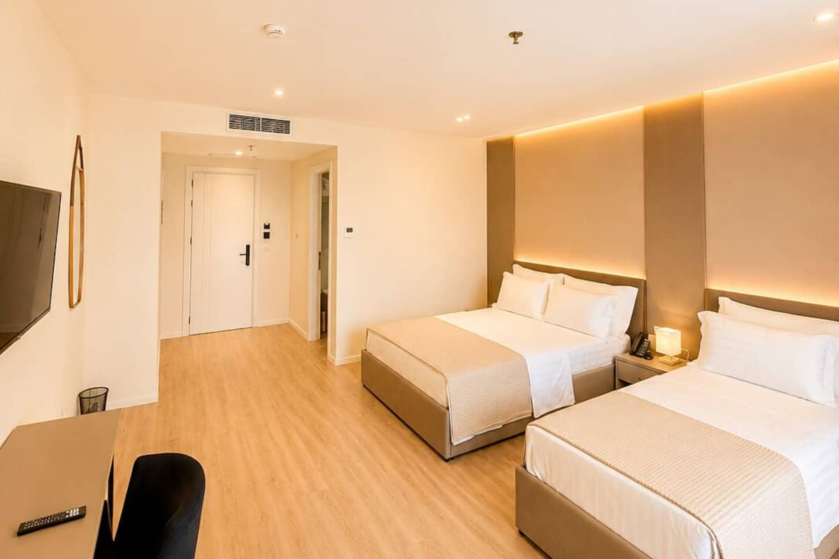 Superior Triple Room, Balcony | In-room safe, desk, laptop workspace, blackout drapes