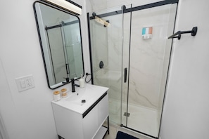 Shower, hair dryer, towels, soap