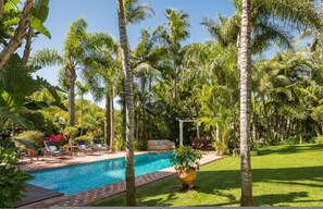 A pool surrounded by palm trees and a small gazebo. - Grand Marbella Estate with tropical gardens (Marbella)