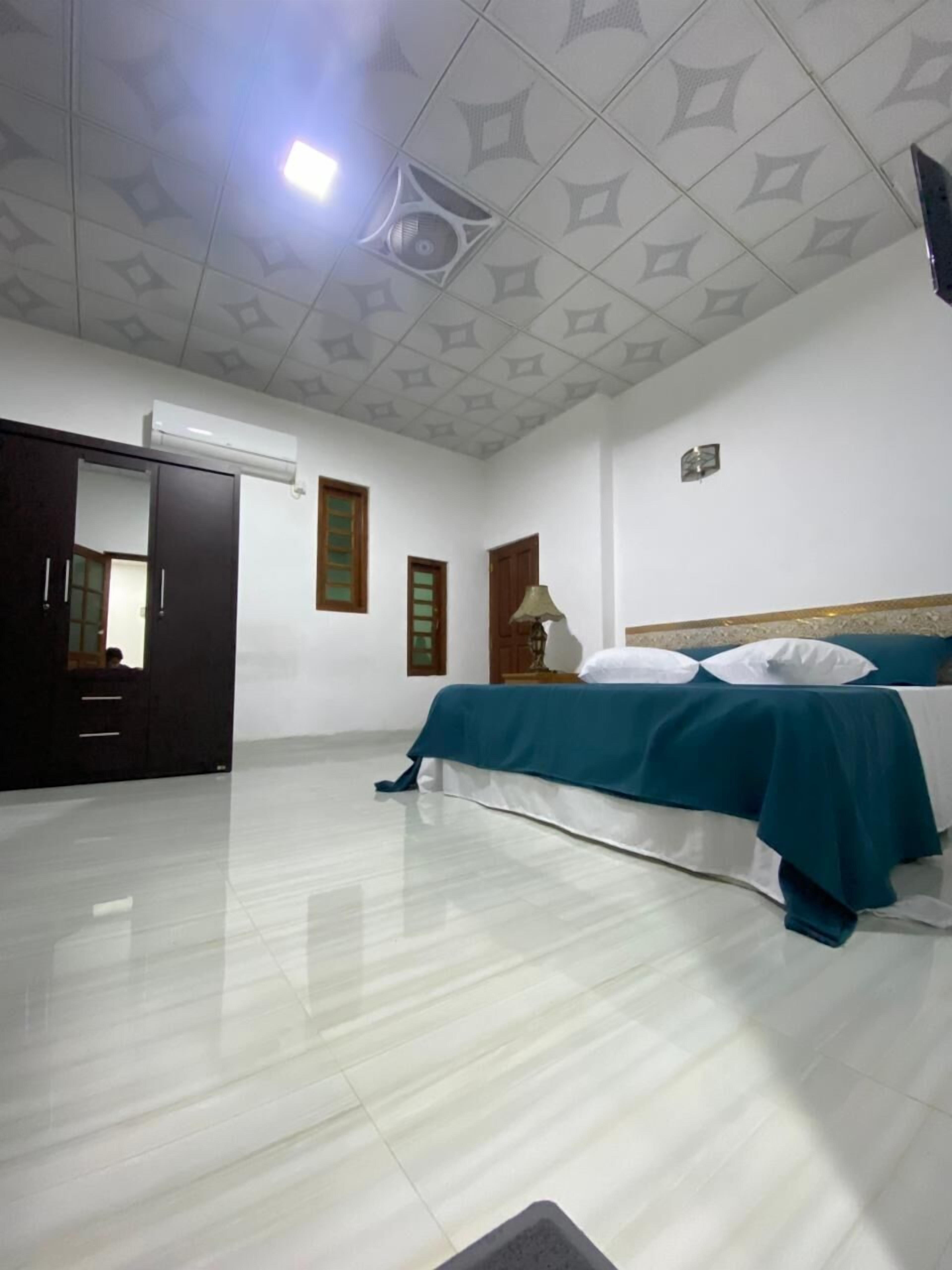 Premium bedding, desk, laptop workspace, iron/ironing board