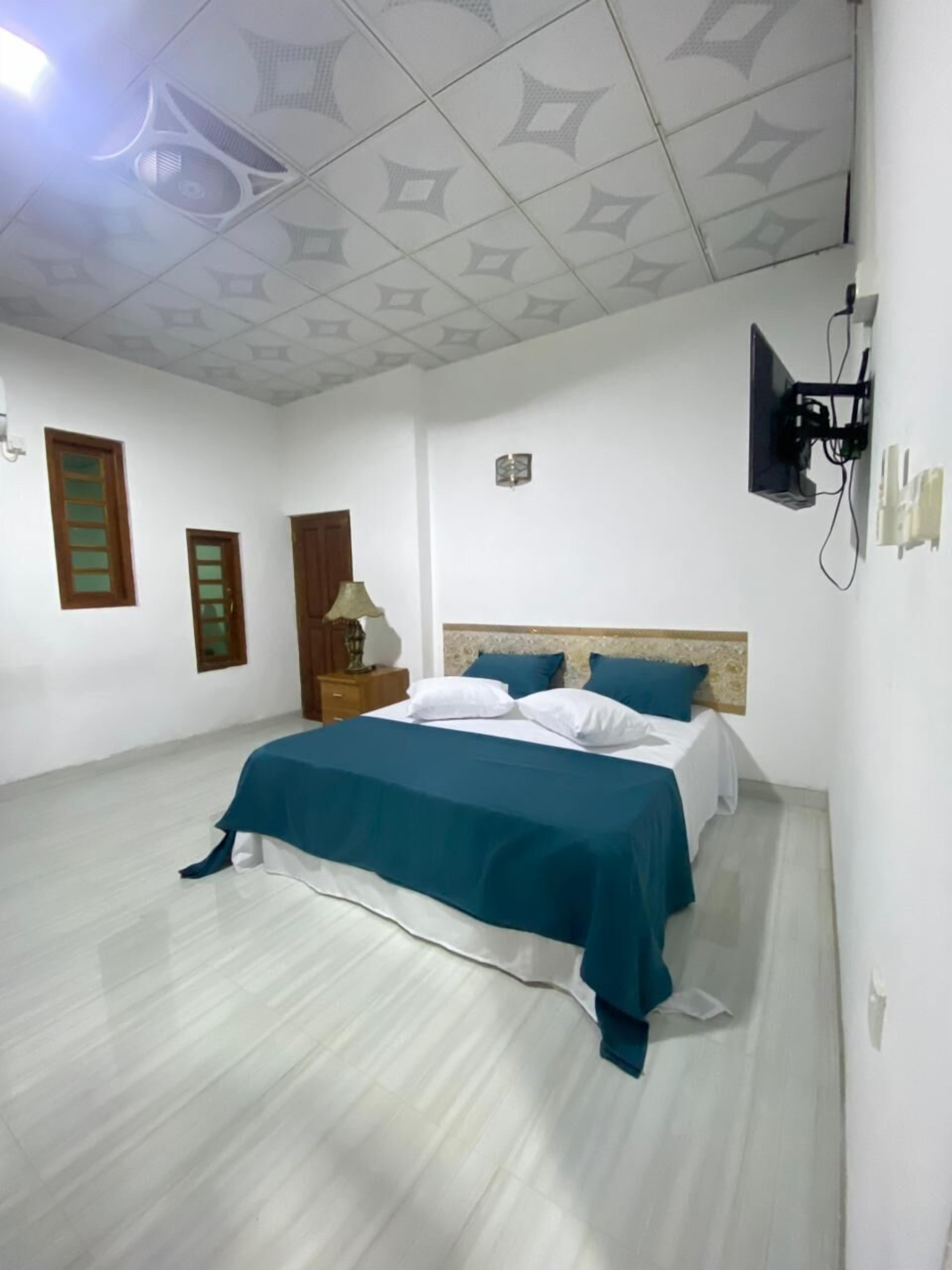 Premium bedding, desk, laptop workspace, iron/ironing board