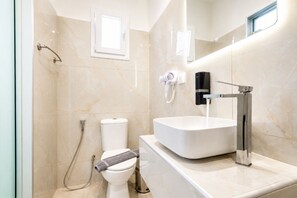 Shower, hair dryer, towels, soap