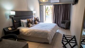 Deluxe Double Room, Patio | In-room safe, blackout drapes, iron/ironing board, free WiFi