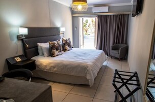 Deluxe Double Room, Patio | In-room safe, blackout drapes, iron/ironing board, free WiFi