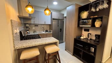 Luxury Apartment, Balcony, Pool View | Private kitchen | Fridge, microwave, oven, stovetop