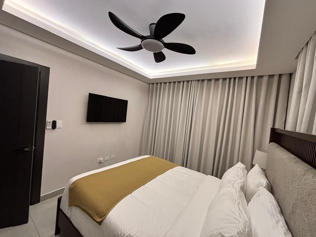 Luxury Apartment, Balcony, Pool View | Desk, laptop workspace, blackout drapes, soundproofing