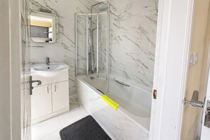 Separate tub and shower, deep soaking tub, hair dryer, towels