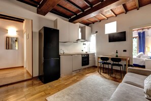 Apartment | Living area | 30-inch flat-screen TV with digital channels - Romana Apartment by Mamo Florence (Firenze)