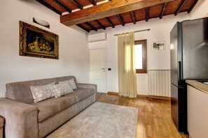 Apartment | Living area | 30-inch flat-screen TV with digital channels - Romana Apartment by Mamo Florence (Firenze)