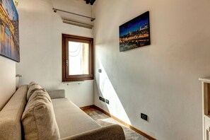Apartment | Living area | 30-inch flat-screen TV with digital channels - Romana Apartment by Mamo Florence (Firenze)