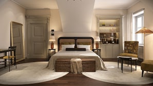 A bedroom with a large bed, a chest of drawers, a chair, a table, a mirror, and a window.
