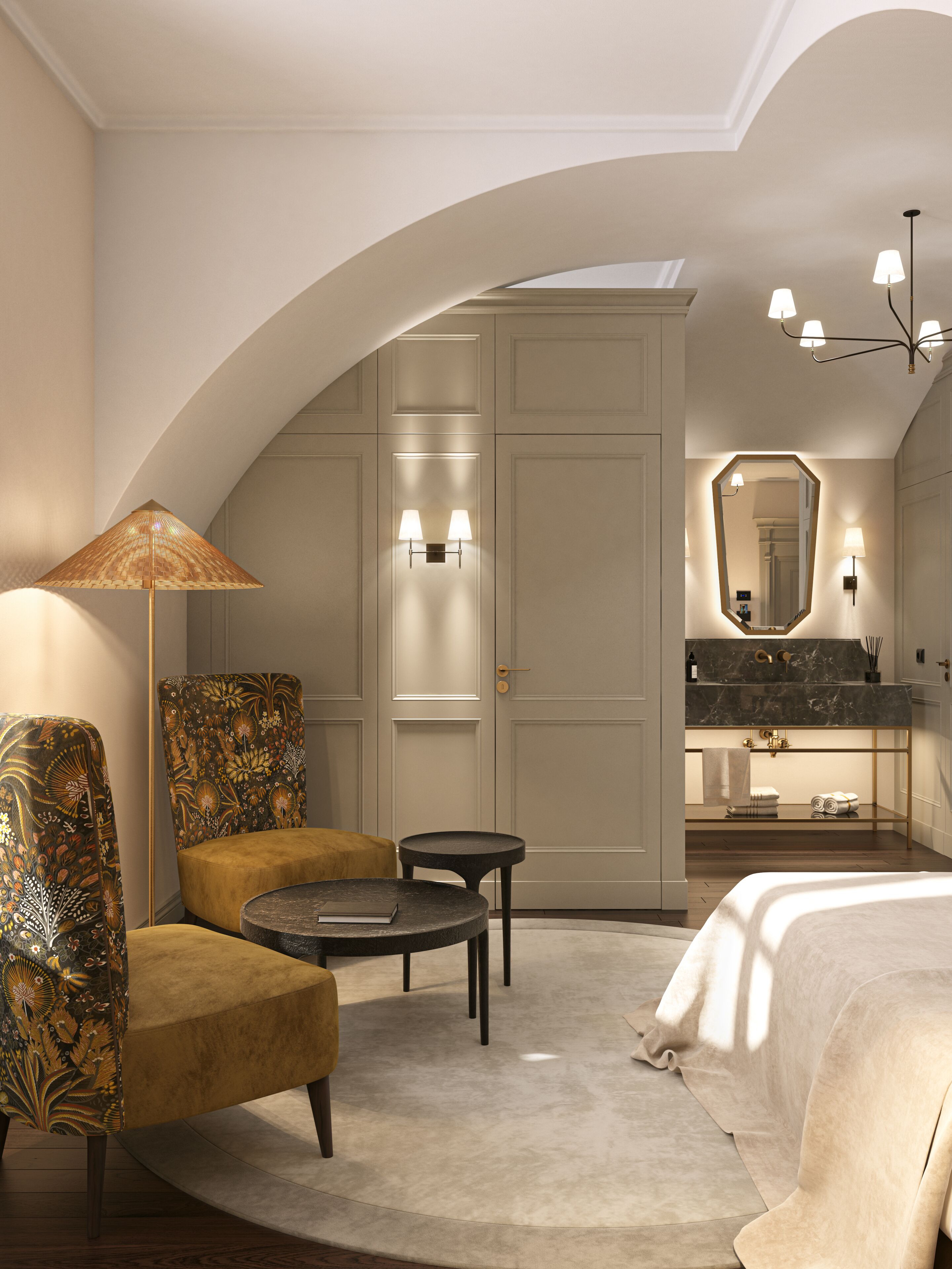 Habitación de hotel con techo curvo, cama, zona de estar con una silla y una mesa, espejo y baño con lavamanos y toallero.