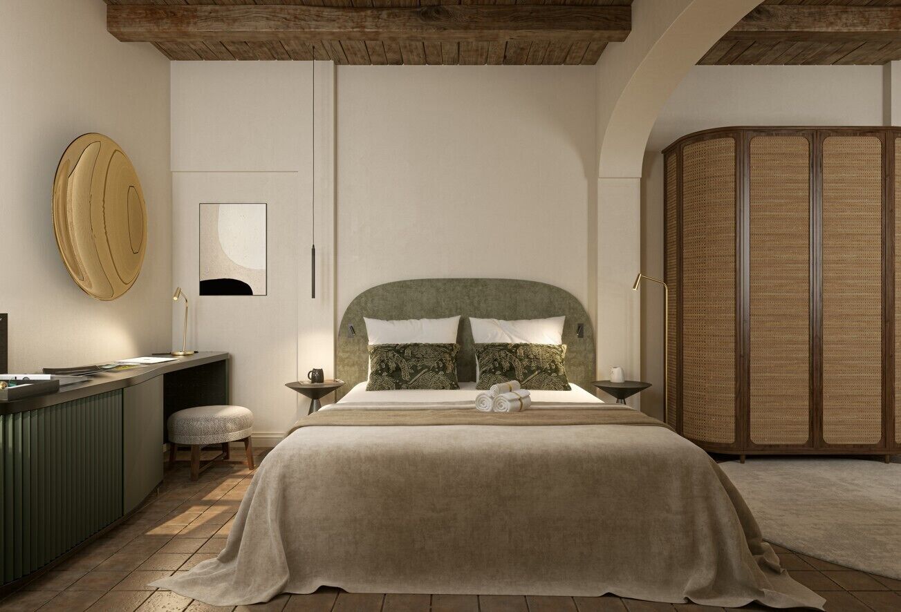 Une chambre à coucher comprenant un lit, des tables de chevet, une commode, un miroir et une armoire.