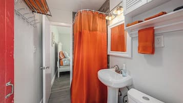 Shower, hair dryer, towels, toilet paper
