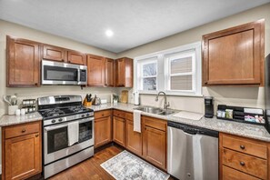 Fridge, microwave, oven, stovetop - Cozy 3BR Tudor Home w/ Spacious Backyard (South Euclid)
