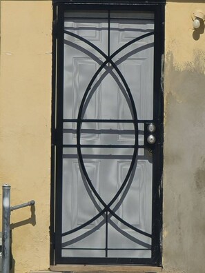 A door with a geometric design, a handle, and a keyhole.