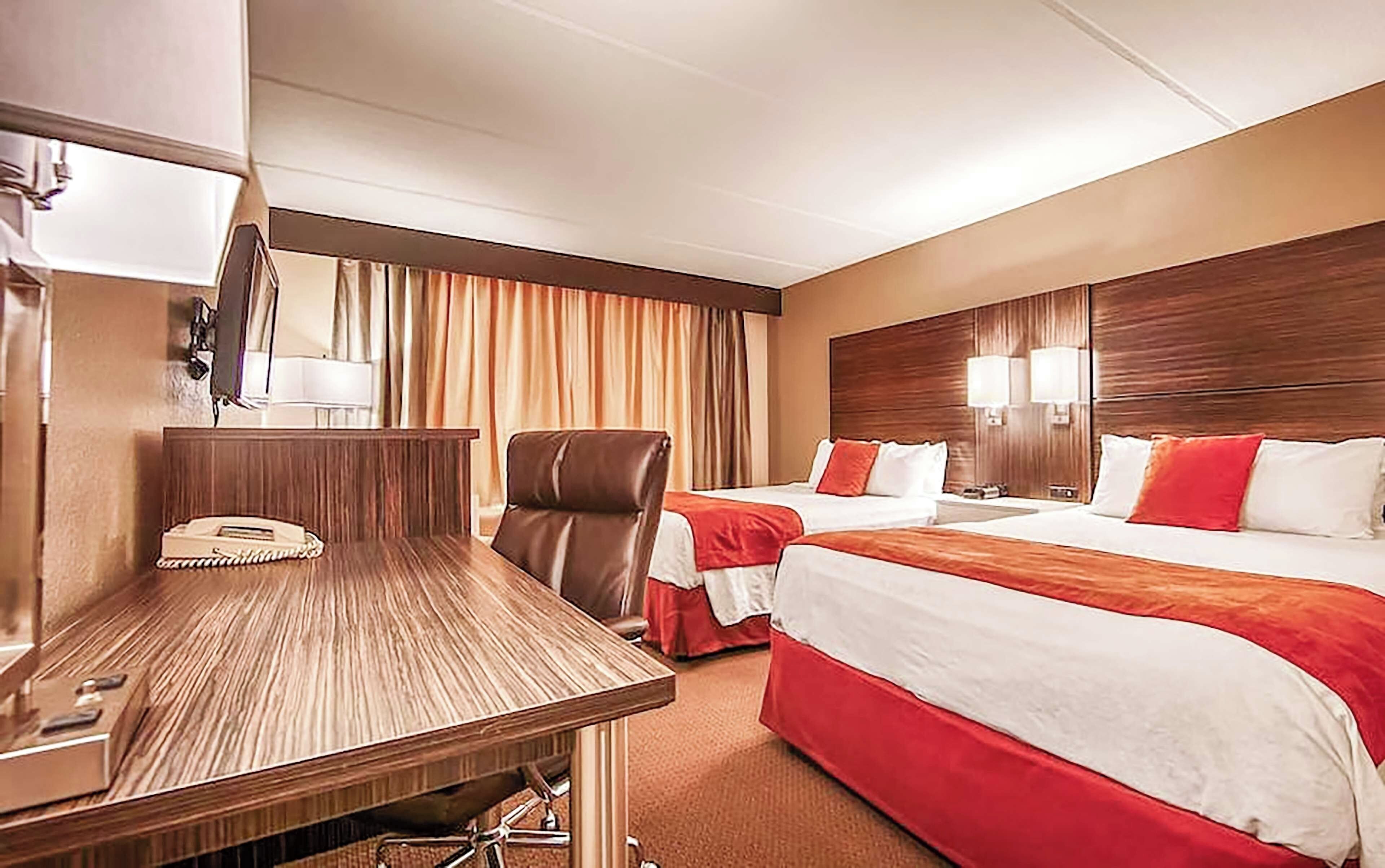 Settle in together with two plush beds and warm lighting.