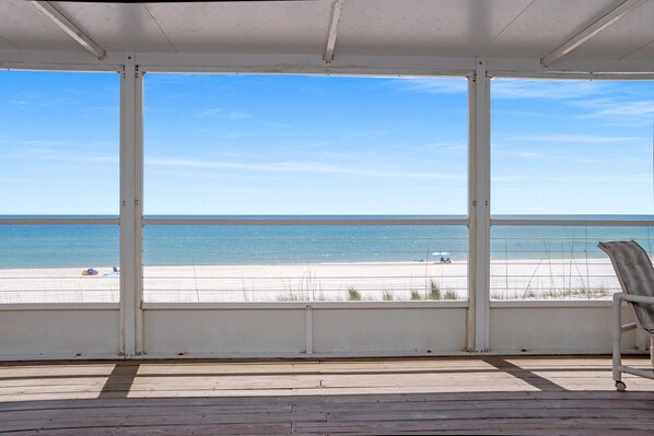 A covered deck with a view of the beach. - Turtle's Nest (Port St. Joe)