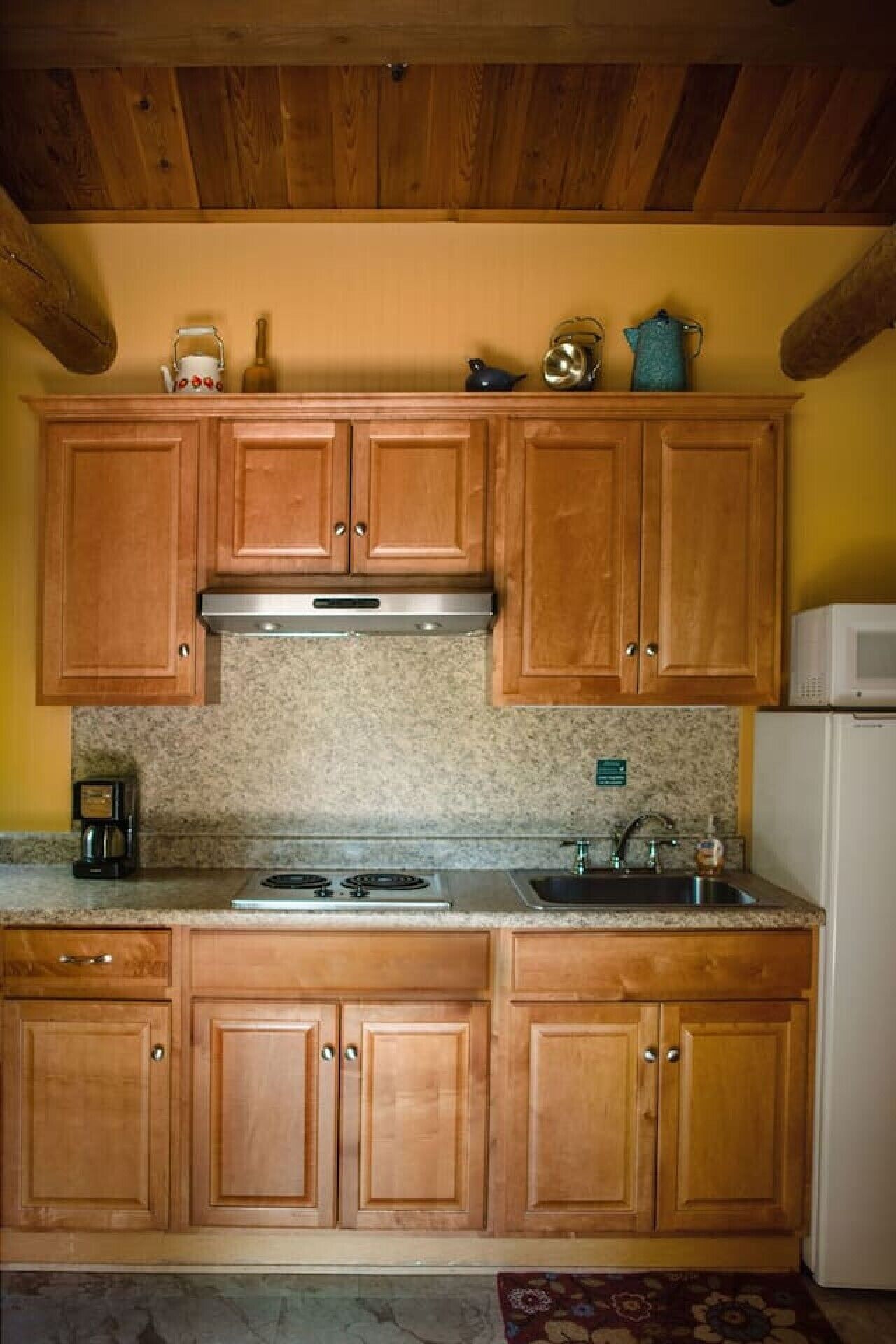 Fridge, microwave, coffee/tea maker, cookware/dishes/utensils