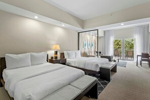 A hotel room with two beds, a desk, a chair, a balcony with a view, and a large mirror. - Bright Studio Suite w/ Balcony, Kitchen & Pool (Miami)