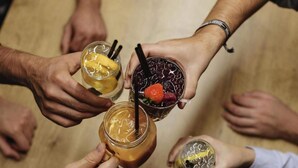 A group of people holding drinks around a table. - 2 Person Holiday Park Home in Dortmund (Dortmund)