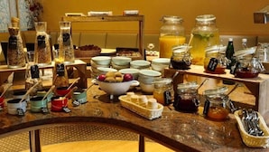 A breakfast buffet with various food items and condiments. - 2 Person Holiday Park Home in Dortmund (Dortmund)