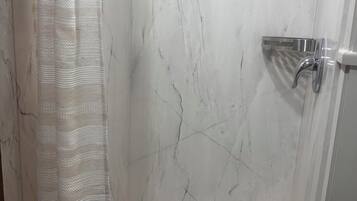 Shower, towels, soap, toilet paper