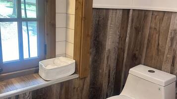 Shower, towels, soap, toilet paper