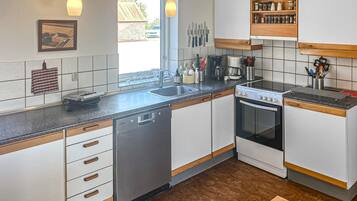 Fridge, stovetop, dishwasher, coffee/tea maker