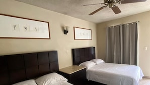 A hotel room with two beds, a ceiling fan, and framed pictures on the wall. - Hotel los Pinos (Cadereyta Jiménez)
