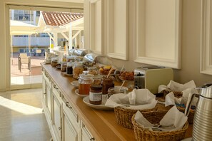 A breakfast buffet with various food items and a toaster.
