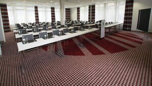 A conference room with multiple tables, chairs, and a carpeted floor. - 4 Person Holiday Park Home in Neu-isenburg (Neu-Isenburg)