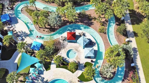 A resort with multiple swimming pools, sun loungers, and palm trees. - 9 Themed Bedrooms, Pool & Jurassic Theater (Kissimmee)
